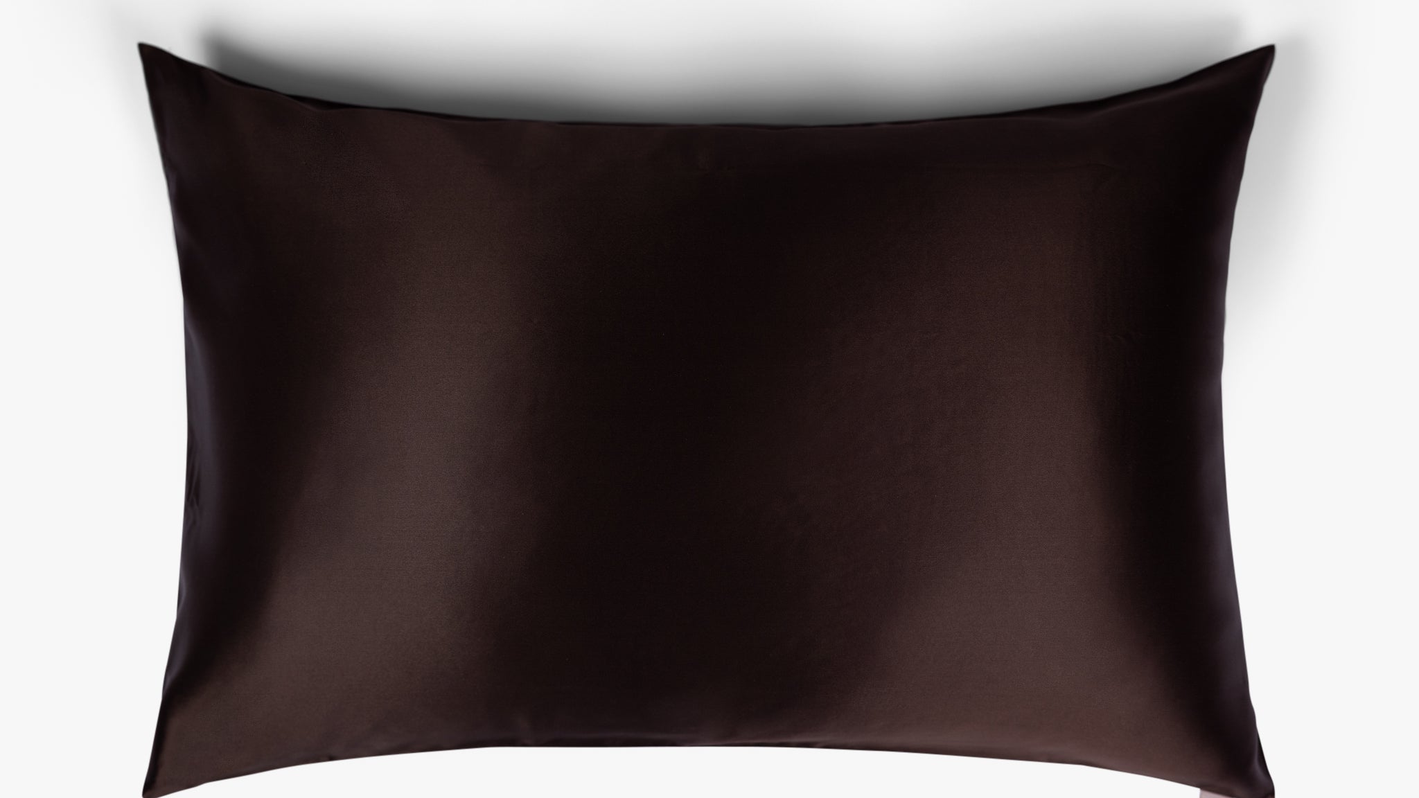 Coffee mulberry silk pillowcase on white background