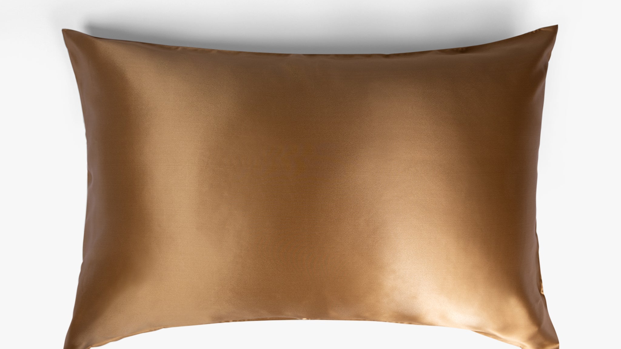 Amber gold mulberry silk pillowcase on white background