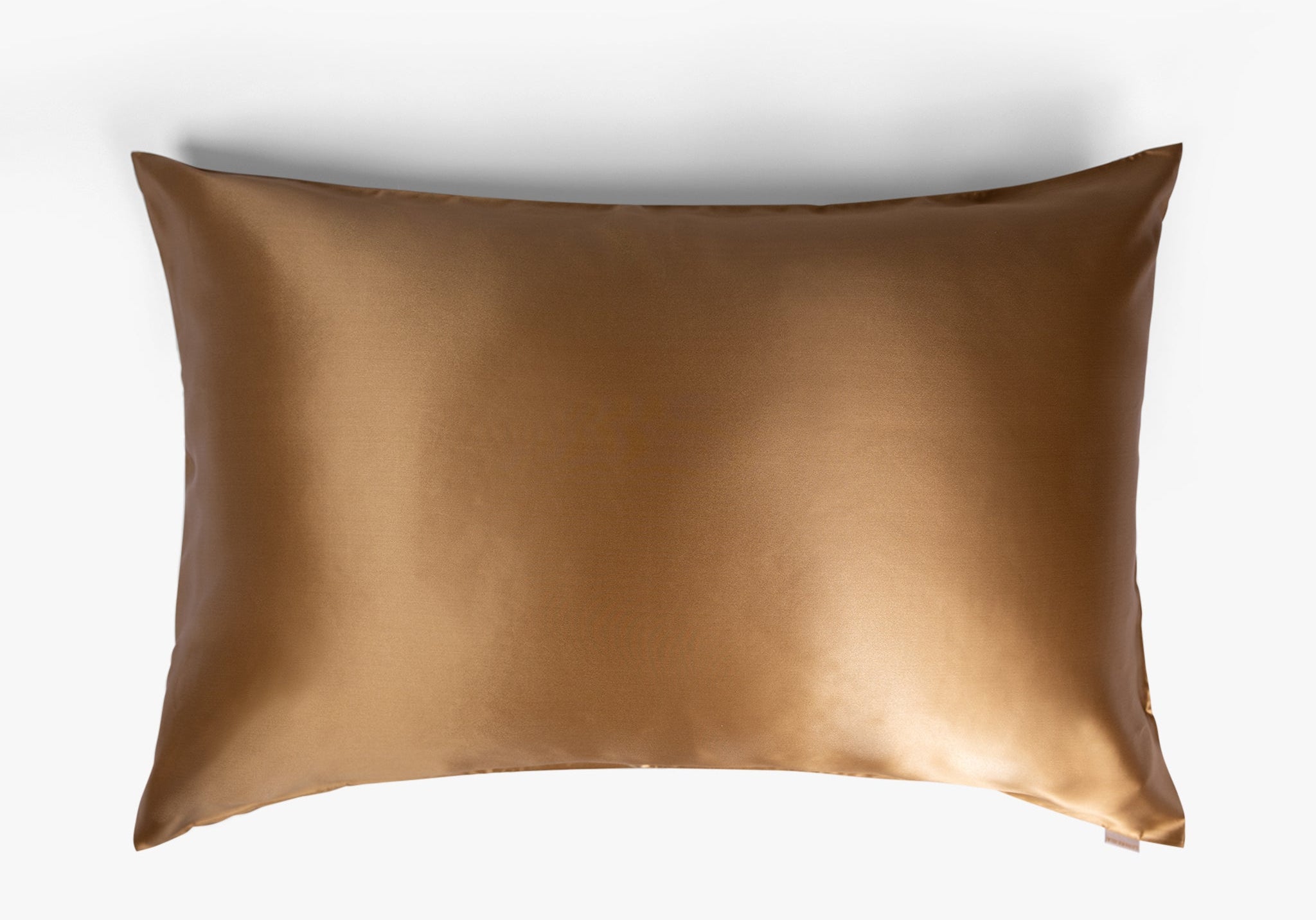 Amber gold mulberry silk pillowcase on white background