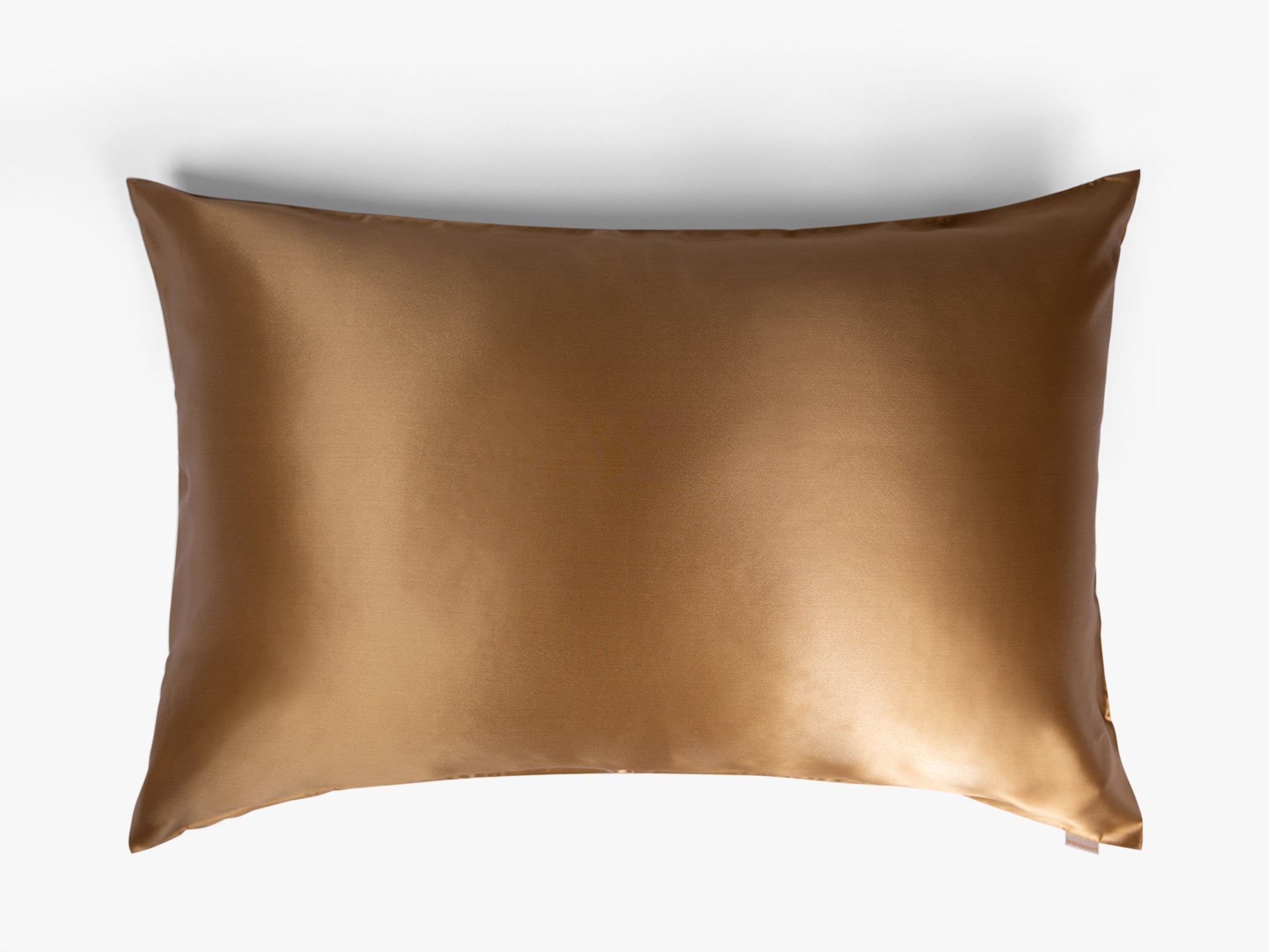 Amber gold mulberry silk pillowcase on white background