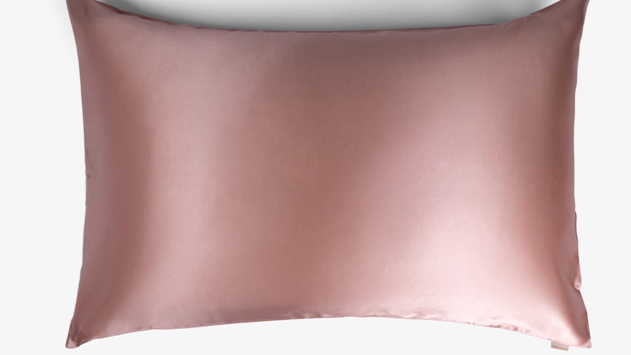 Cherry pink mulberry silk pillowcase on white background