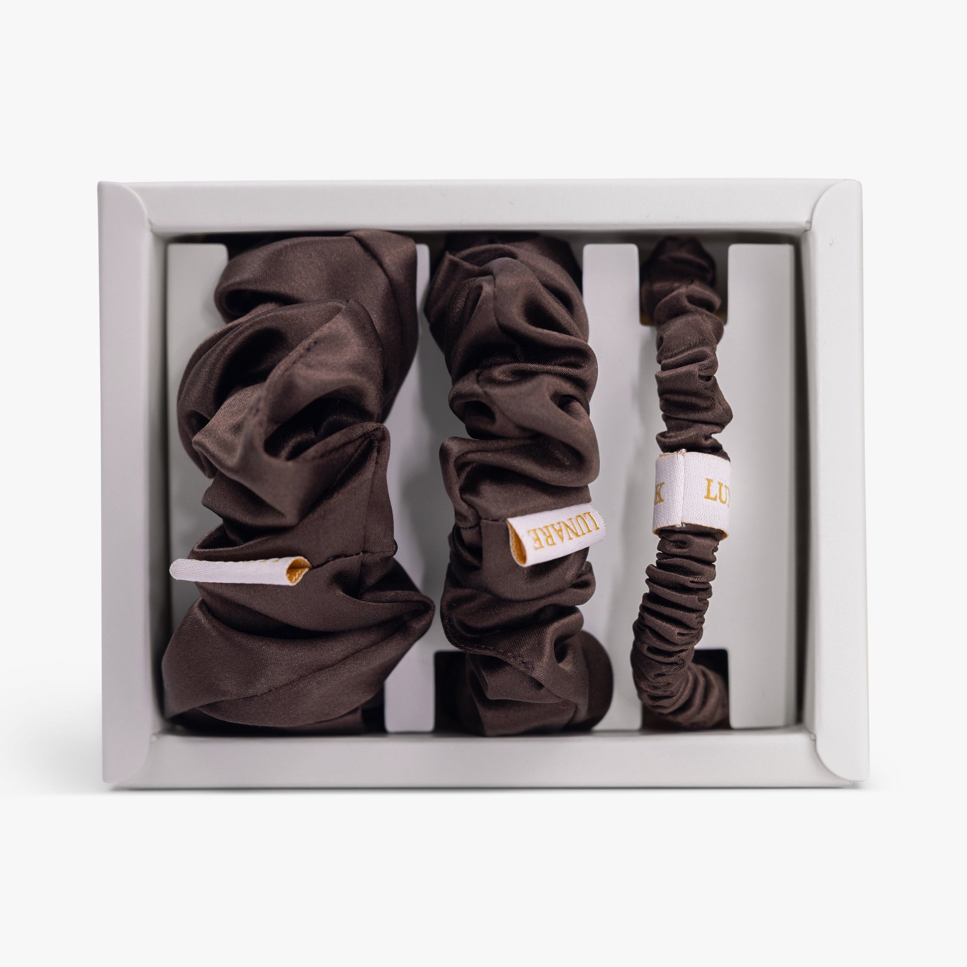Coffee silk scrunchies set in open box top view lunare logo

