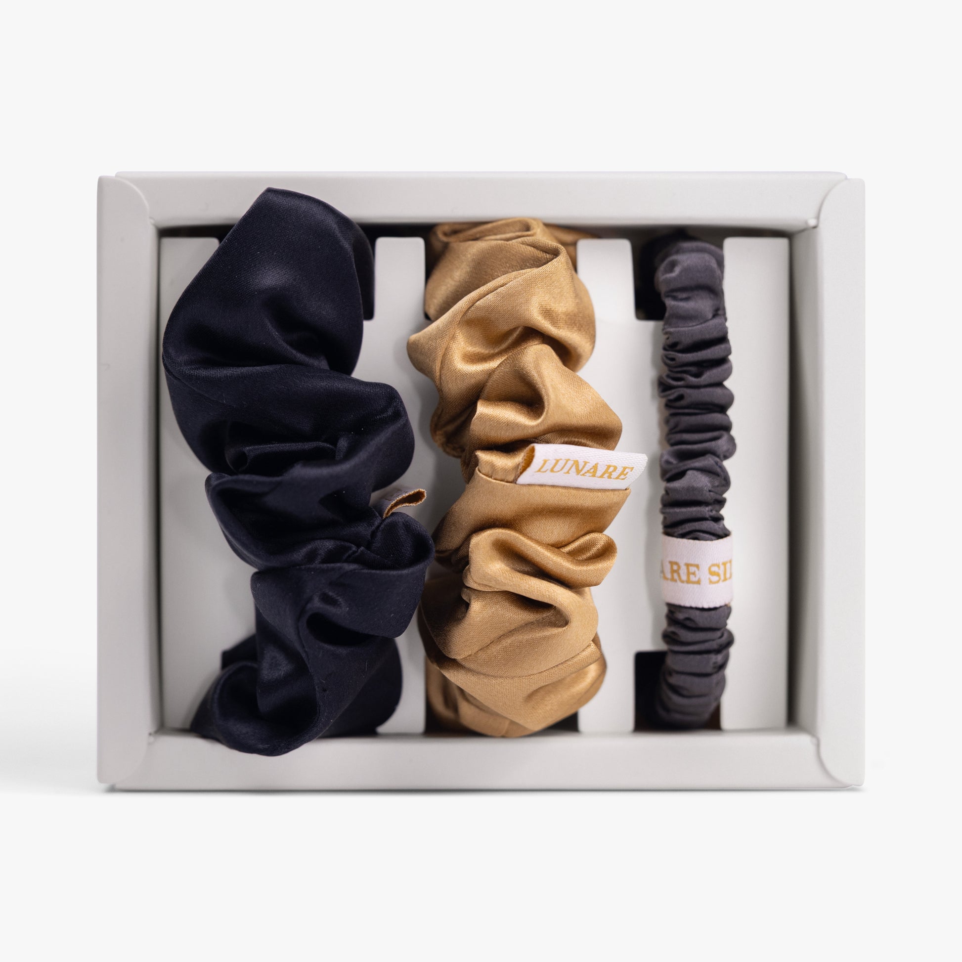 Classic neutral silk scrunchies set in open box top view
