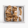 Set of Amber gold scrunchies and headbands with 'LUNAIRE' branding in a box.