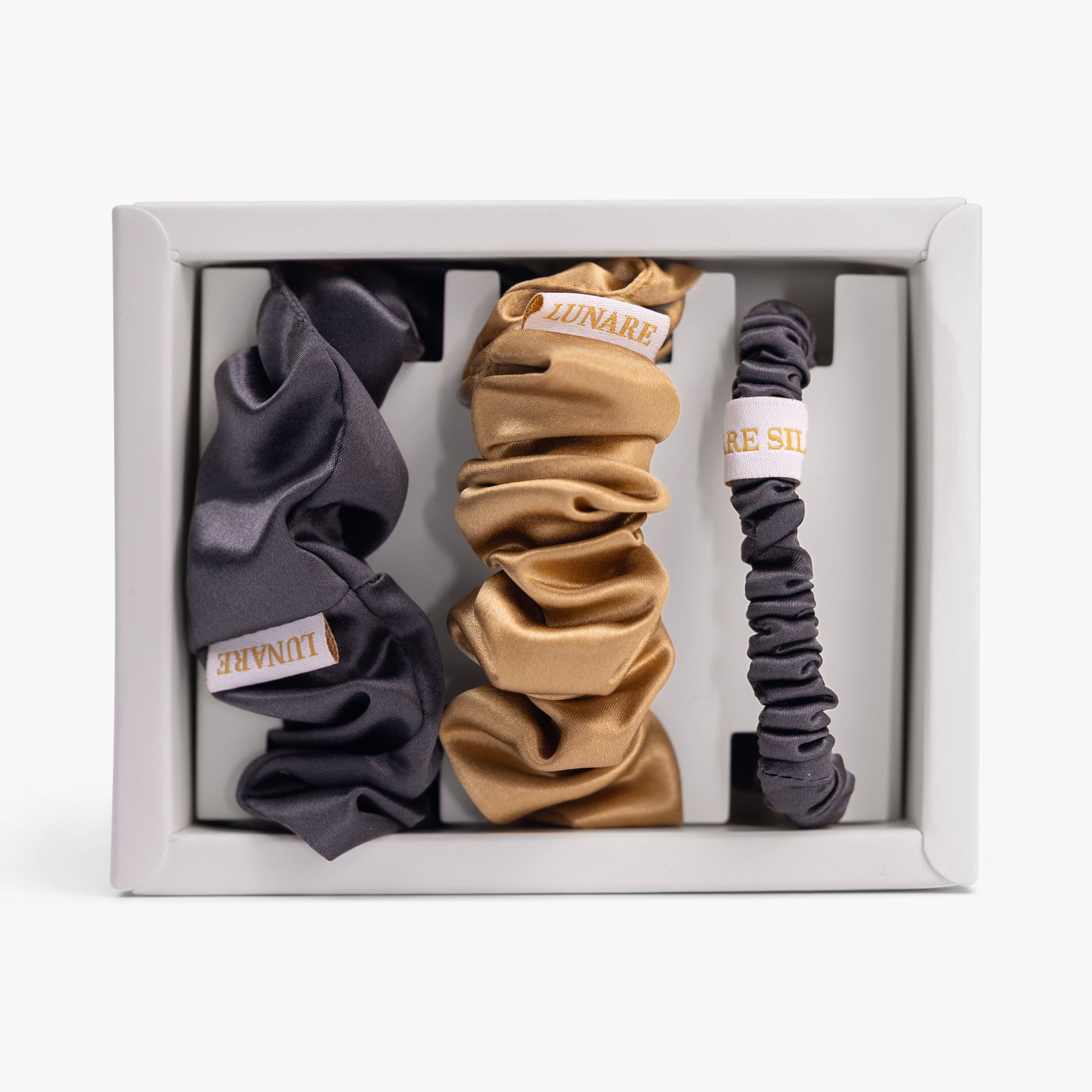 Warm contrast silk scrunchies set in open box top view
