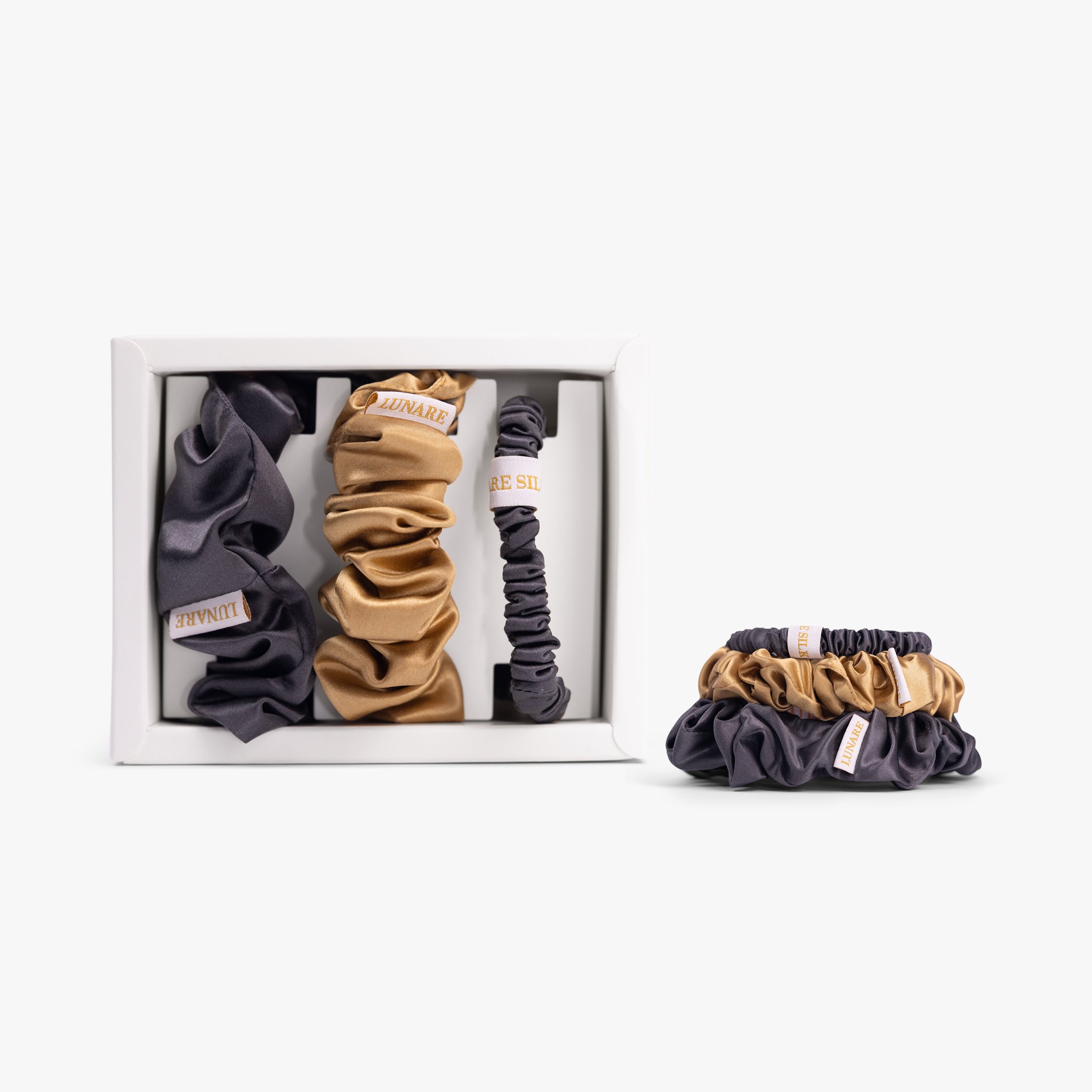 Warm contrast silk scrunchies set on white background
