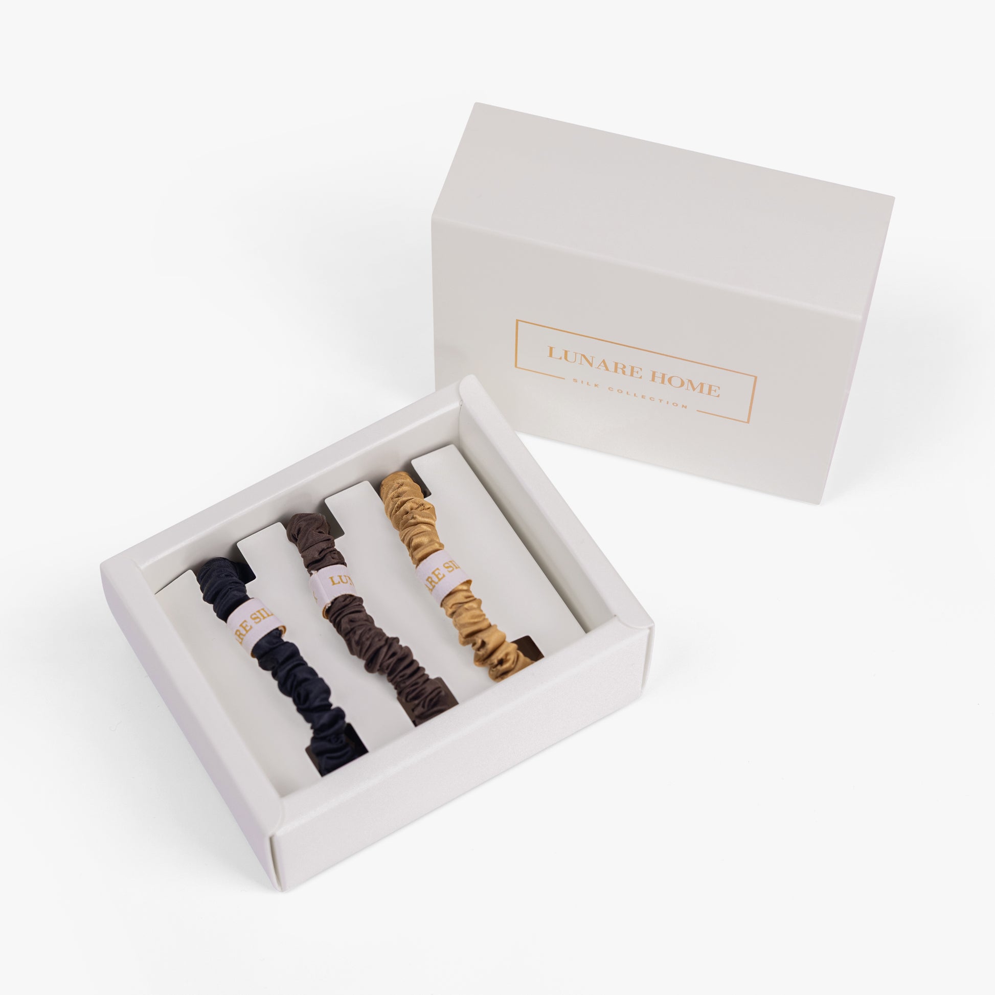 Set of hair ties in a white box with 'LUNAIRE HOME' branding on a white background