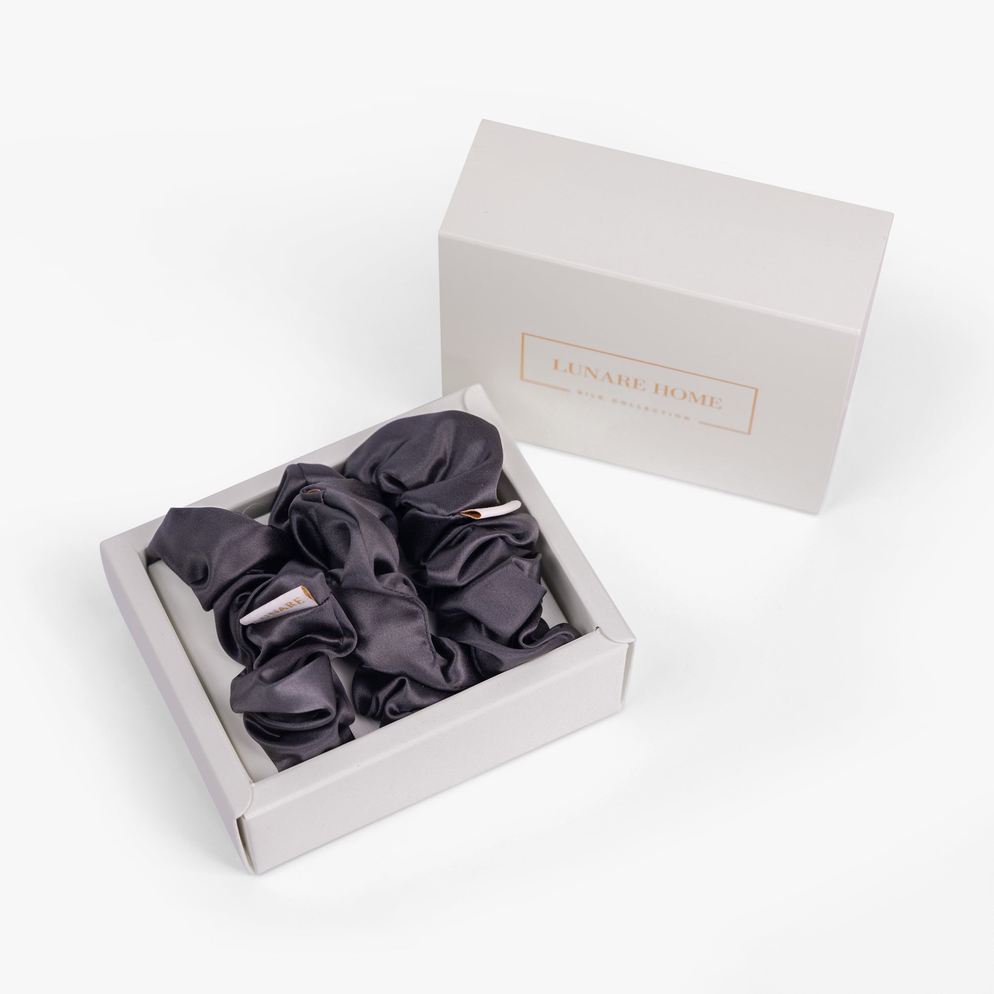 Dark grey large silk scrunchie in open gift box with Lunare Home lid
