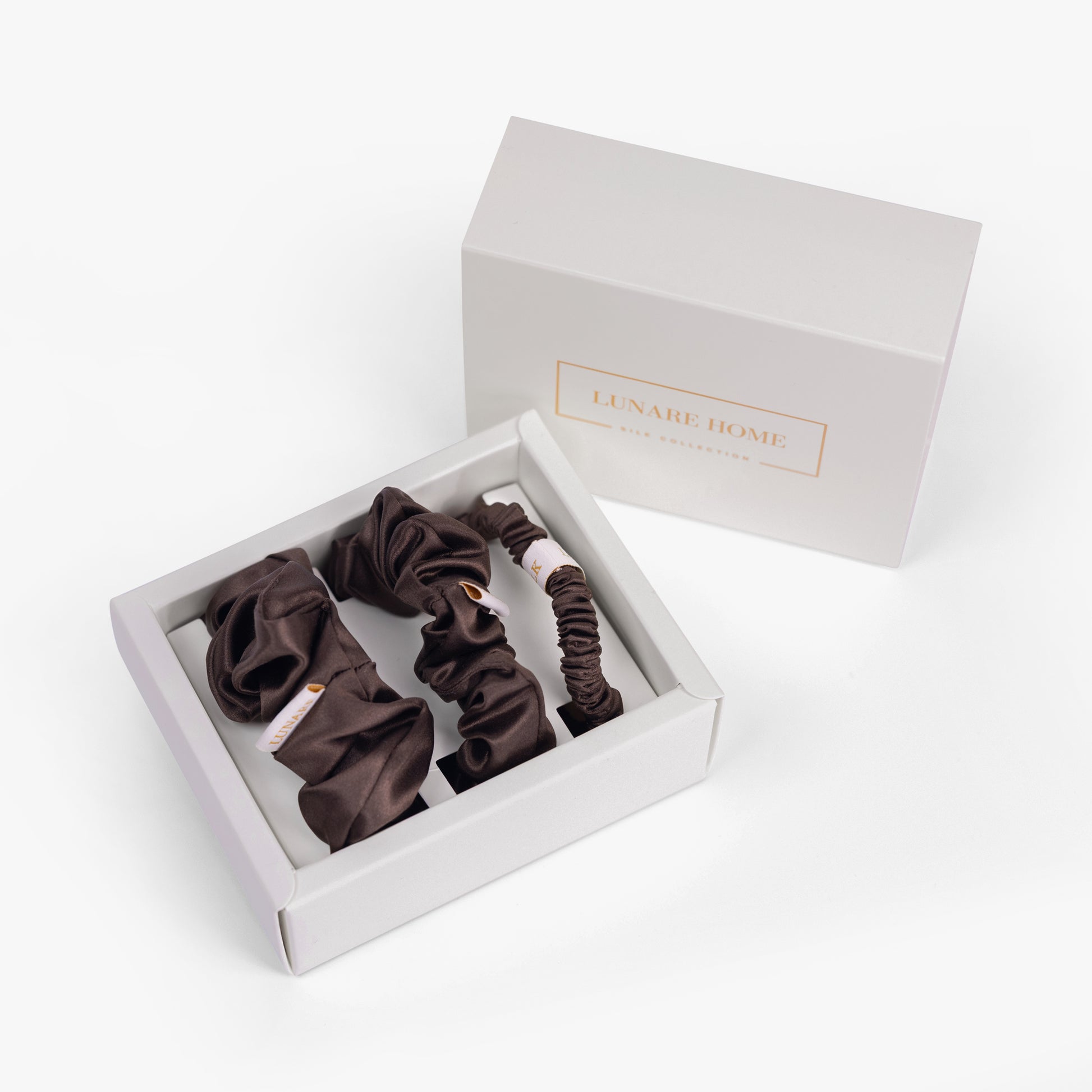 Coffee silk scrunchies in open gift box with Lunare Home lid
