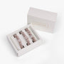 Set of hair ties in a branded box on a white background