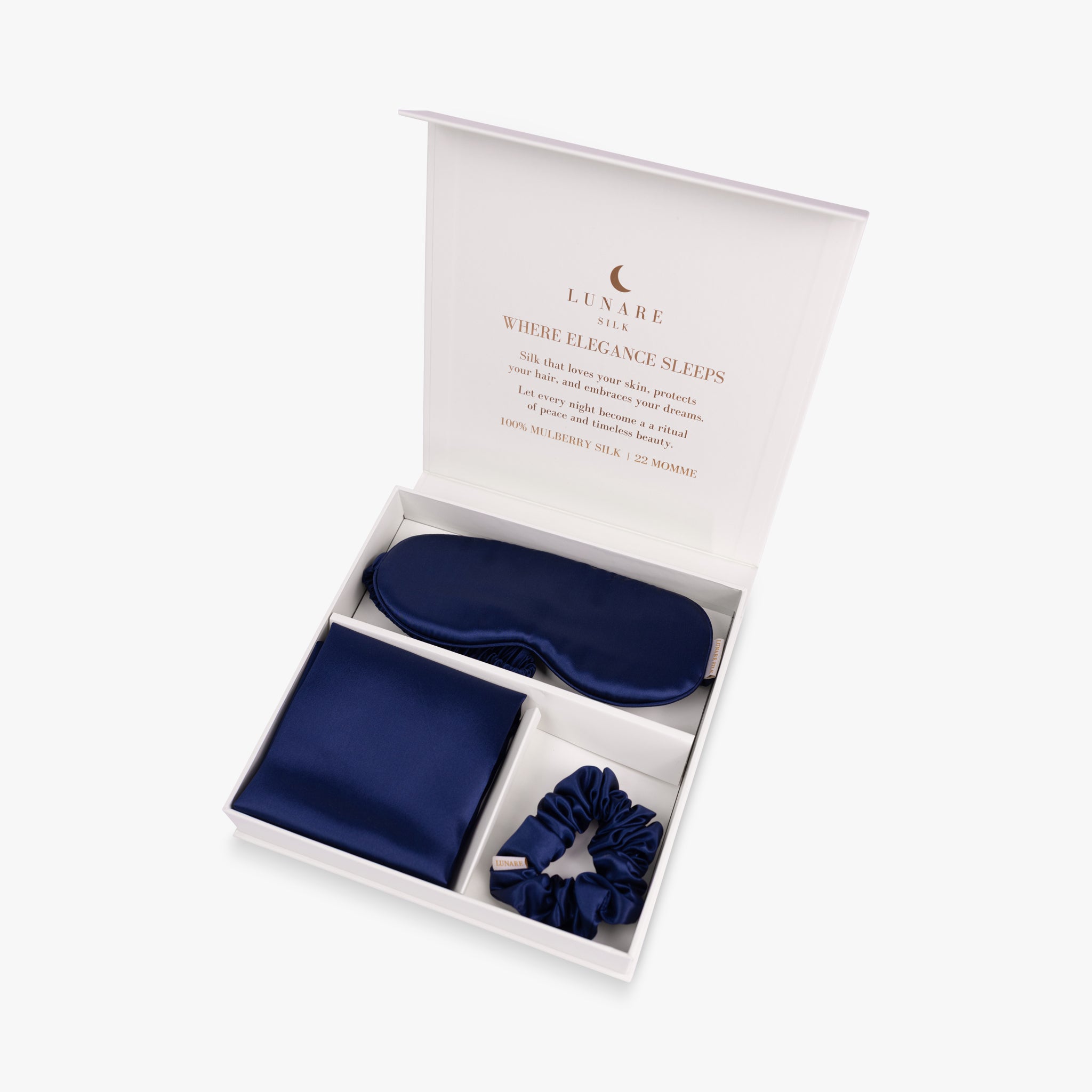 Navy blue ritual silk bundle set in open gift box
