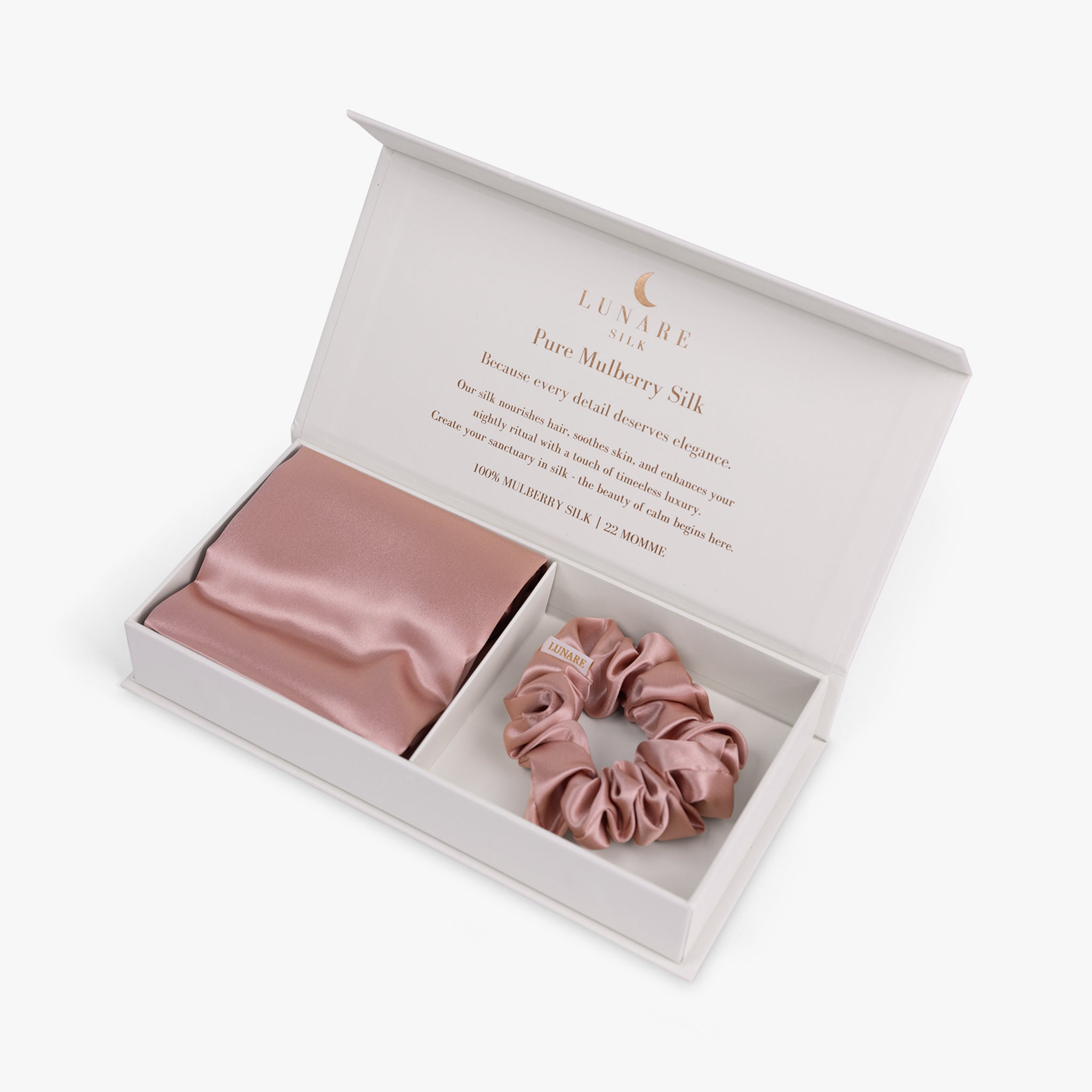 Rose gold essential silk bundle in open box with pillowcase and scrunchie
