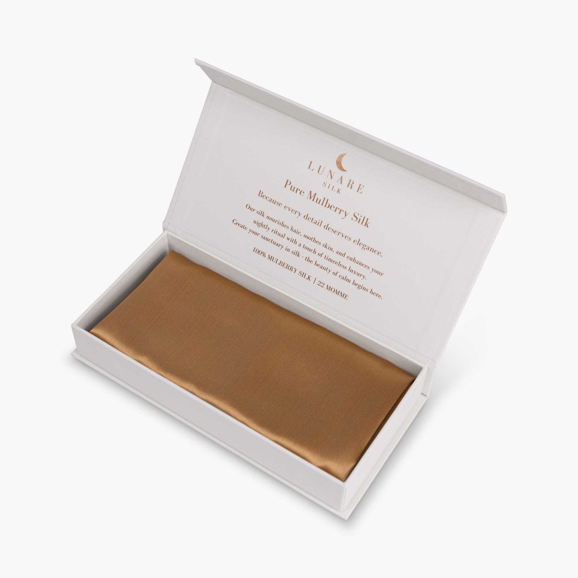 Amber gold silk pillowcase in open gift box
