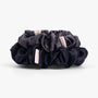 Deep neutral silk scrunchies close-up view

