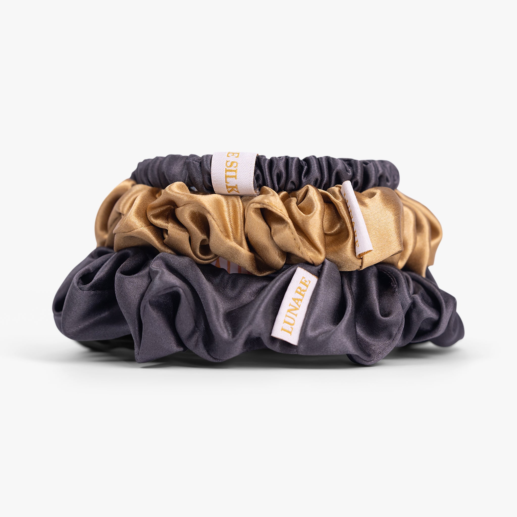 Warm contrast silk scrunchies close-up view
