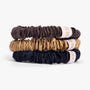 Three scrunchies in brown, beige, and navy on a white background