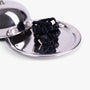Black silk scrunchies on silver tray with lid
