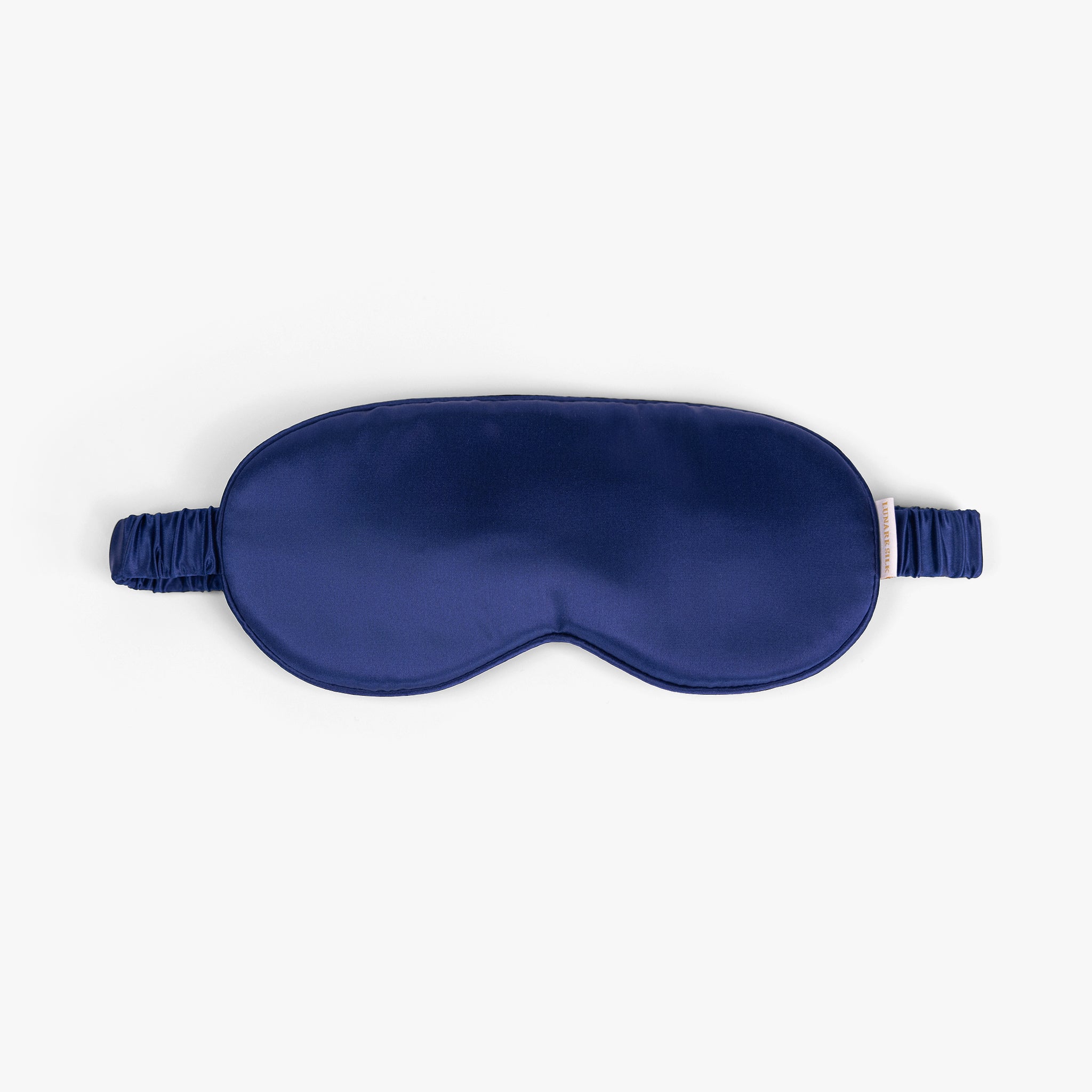 Navy blue silk eye mask on white background
