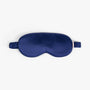 Navy blue silk eye mask on white background
