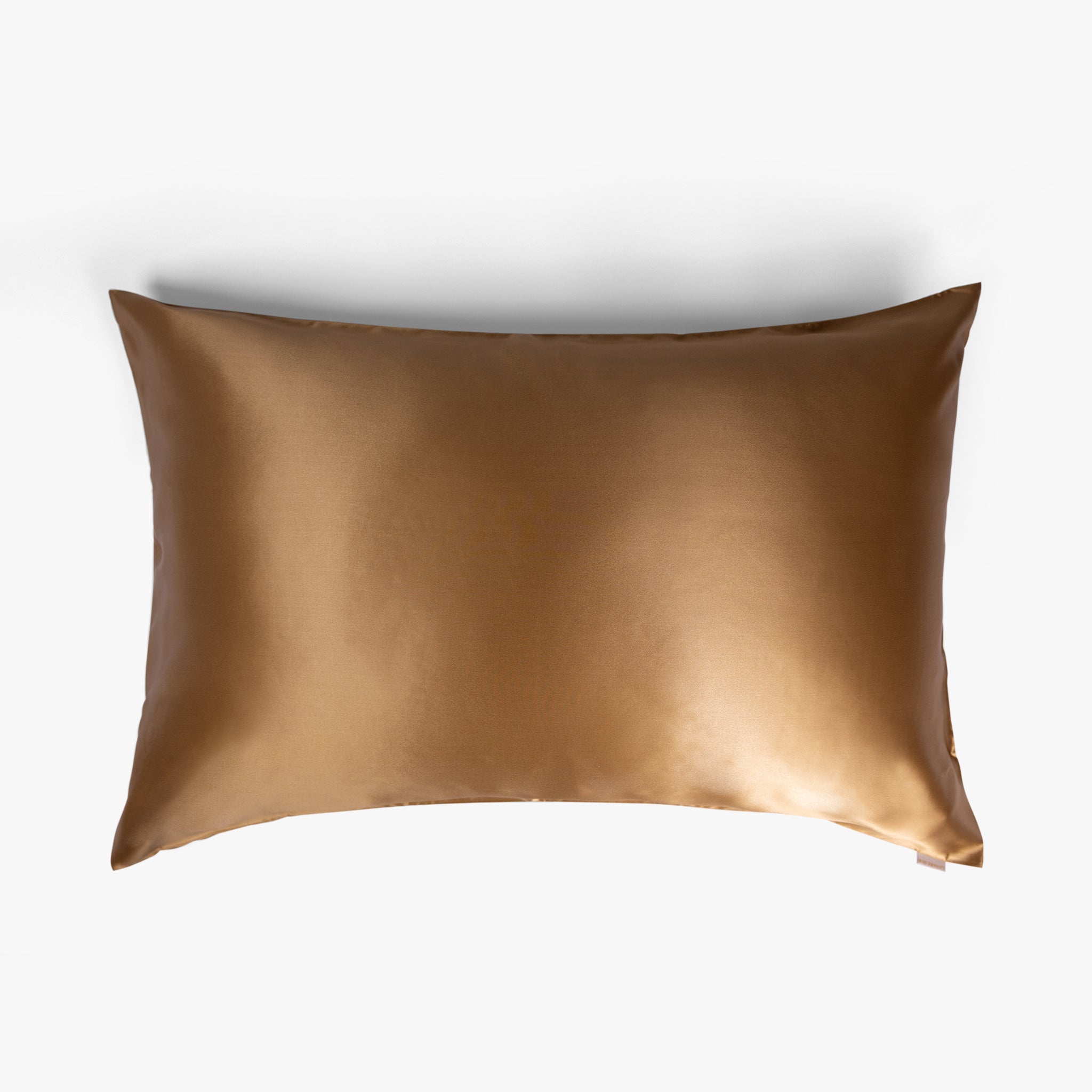 Amber gold silk pillowcase on white background
