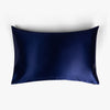 Navy blue silk pillowcase on white background
