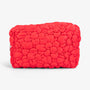 Red quilted floral cosmetic bag with gold hardware
